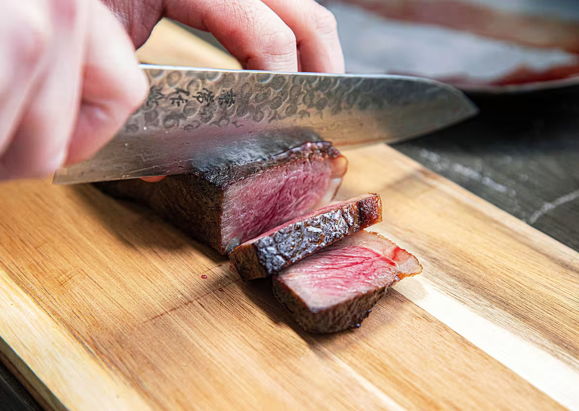 Grilled Wagyu steak prepared for slicing